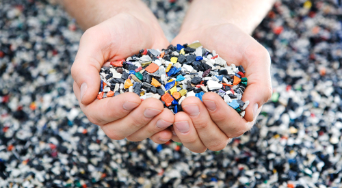 two-hands-holding-shredded-plastic-pieces.png